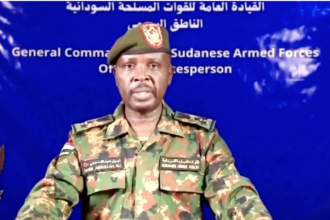A Sudanese army spokesperson gives a statement on Sudan TV after claims of retaking palace